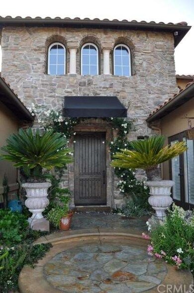 Custom stone facade and stone tiled entrance