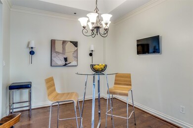 Sitting room with wood finished floors, ornamental
