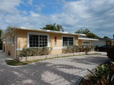 Front left side with pavered driveway