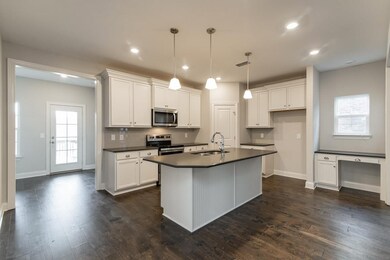 Desk in the kitchen is a nice feature!  Similar home.