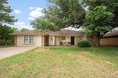 Single story home with a front lawn