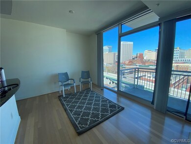 Great Room with a wall of 10 ft windows with stunn