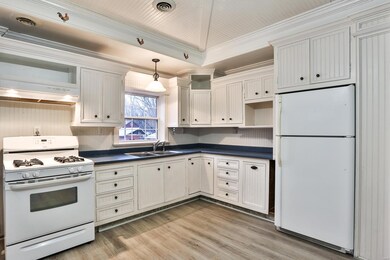 Kitchen has gas stove newer laminate floors