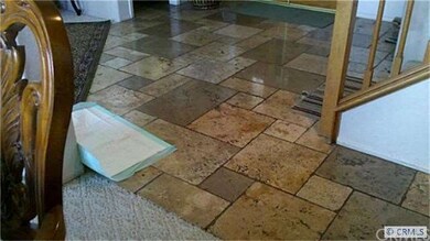 Entrance w/ travertine floors