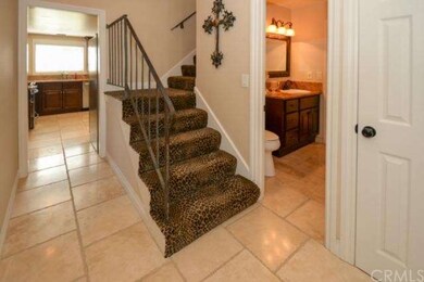 View of stairwell, Travertine Flooring throughout 