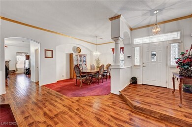 Foyer entrance featuring wood finished floors, cro
