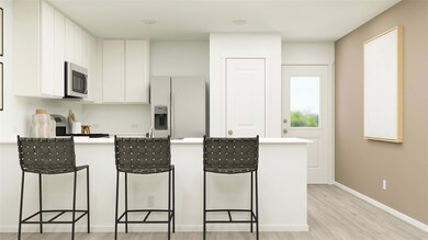 Kitchen with light wood-type flooring, a breakfast