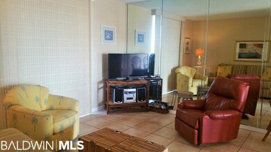 large flat screen and floor to ceiling sliding gla