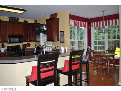 Kitchen - Boomerang shaped island/breakfast bar in