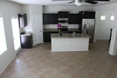 Living, Kitchen and back yard entry