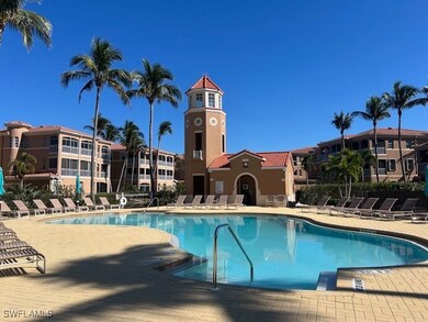 Community pool featuring fence and a patio area