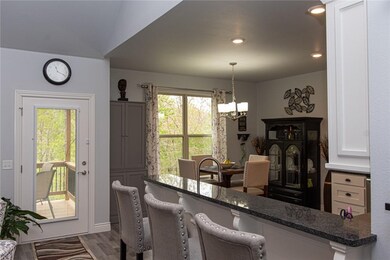 Spacious island looking out to upper covered deck.