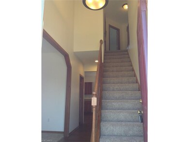 View of two-story foyer from front entrance.