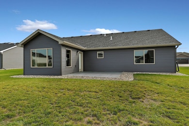 Sunroom walks out to rear concrete patio. Landscaping is completed!