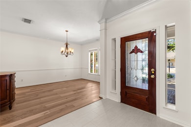 Elevate your dining experience in this elegant, roomy dining room, perfect for gatherings.