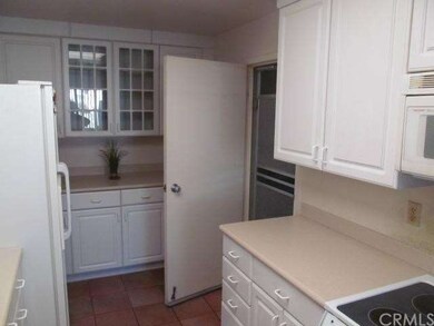 Door leading from kitchen to attached garage