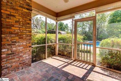 Porch leads to pool, patio and deck. Just opposite