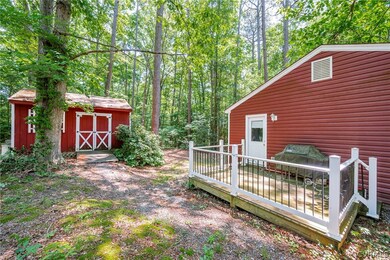 View of yard with a shed and a deck