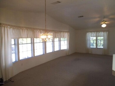 Living Room w/ lrg windows