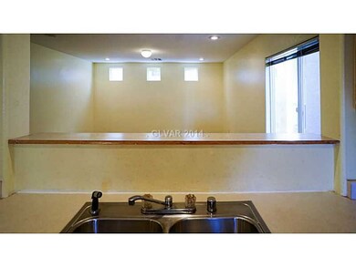 Property Photo. Breakfast Bar off Kitchen looking
