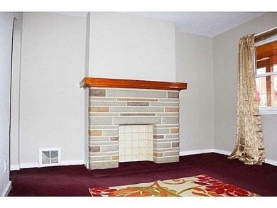 Living Room. decorative stone fireplace adds the p