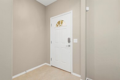 You enter into a cozy Foyer with coat closet at th