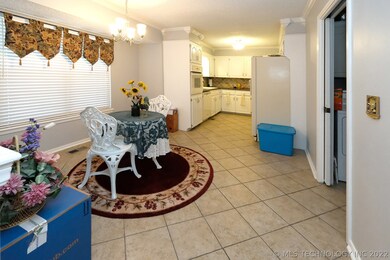 Spacious eating area off of kitchen, large window