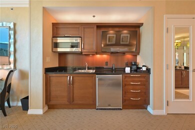 Kitchen featuring stainless steel microwave, brown