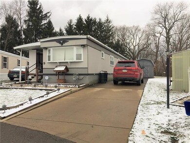 Front showing concrete driveway with room to park 