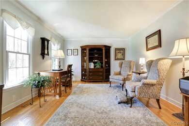 Living Room with Hardwood Floors and Crown Molding