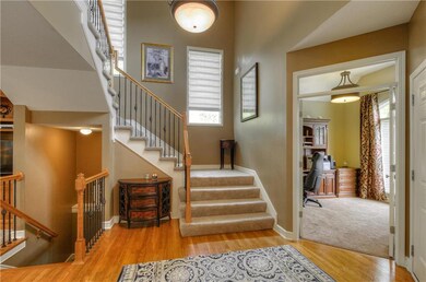 Welcoming entryway. Office w/french doors.
