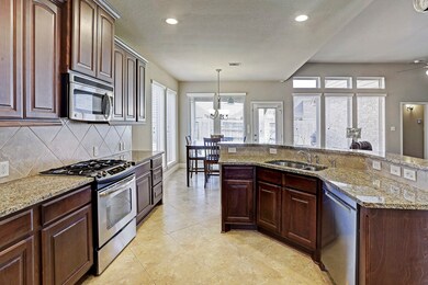 The kitchen features granite counter tops, 42