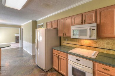 Solid Surface Corian countertops.  Fridge included