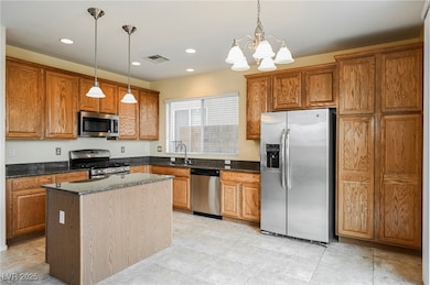 Kitchen with appliances with stainless steel finis