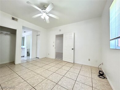Unfurnished bedroom with ceiling fan, visible vent
