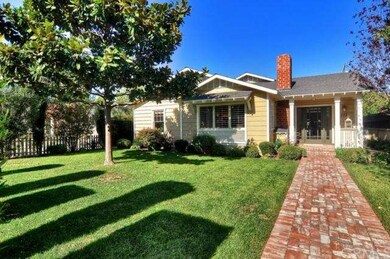 Large front yard, with brick walkway leading to fr