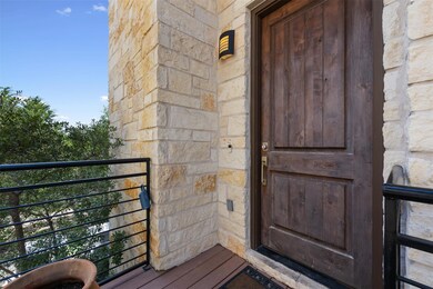 Entrance to property with stone siding