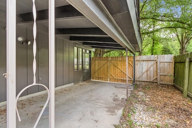 View of patio featuring a gate
