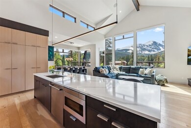 Kitchen island with modern cabinets, open floor pl
