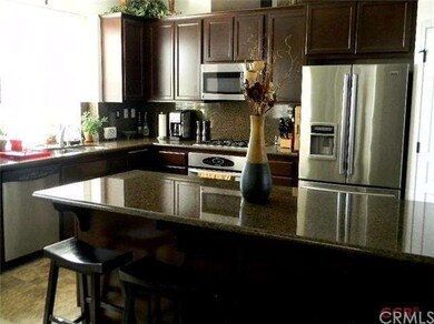 Upgraded kitchen with granite counters and backspl