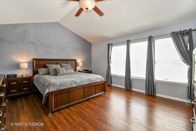 This spacious master bedroom has vaulted ceilings,