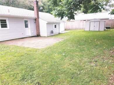 FENCED IN YARD WITH CEMENT BLOCK PATIO