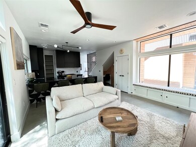 Living area featuring baseboards, visible vents, 