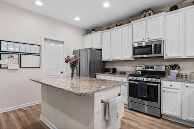 Kitchen with appliances with stainless steel finis