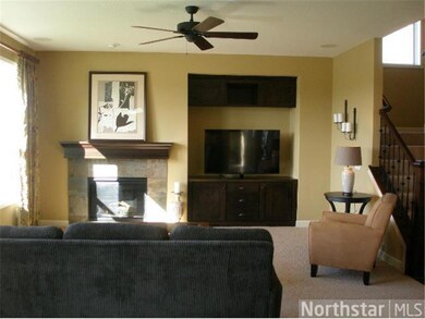 Main floor family room features gas fireplace with