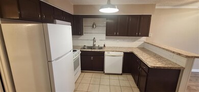Kitchen with dishwashing machine, refrigerator, a 