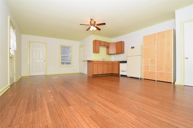 Unfurnished living room with light wood-type floo