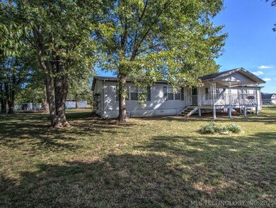 Mature trees grace the property, providing shade a