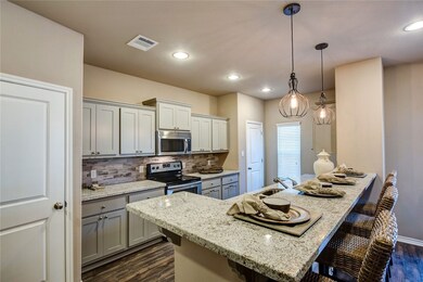 Kitchen with appliances with stainless steel finis