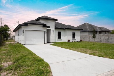 Prairie-style home with a lawn and a garage